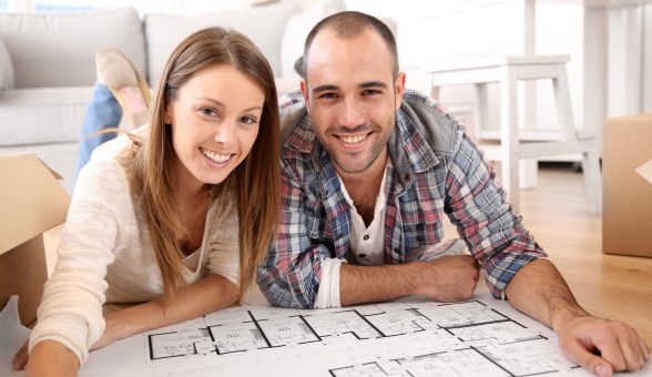 Young couple reviewing home plans